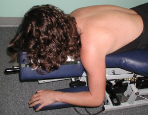 Female lying on a chiropractic drop table