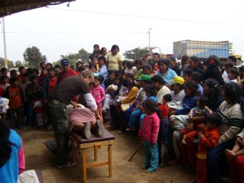 adjusting in Peru crowd of hundreds