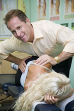 Los Angeles chiropractor demonstrates side posture adjustment.