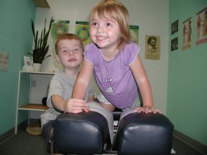 kids on a chiropractic adjusting table