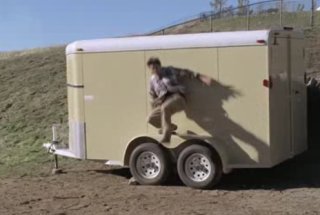 man gets slammed into horse trailer